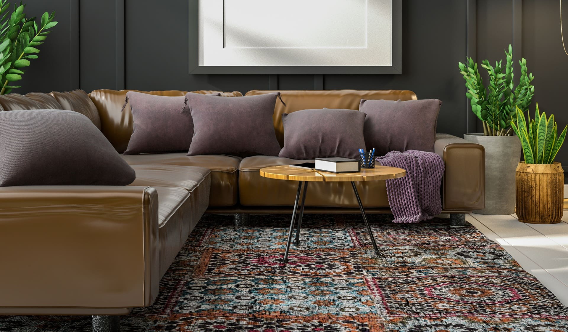 A brown leather sectional sofa with gray pillows, a round wooden coffee table with books, and green potted plants on a patterned rug in a modern living room.